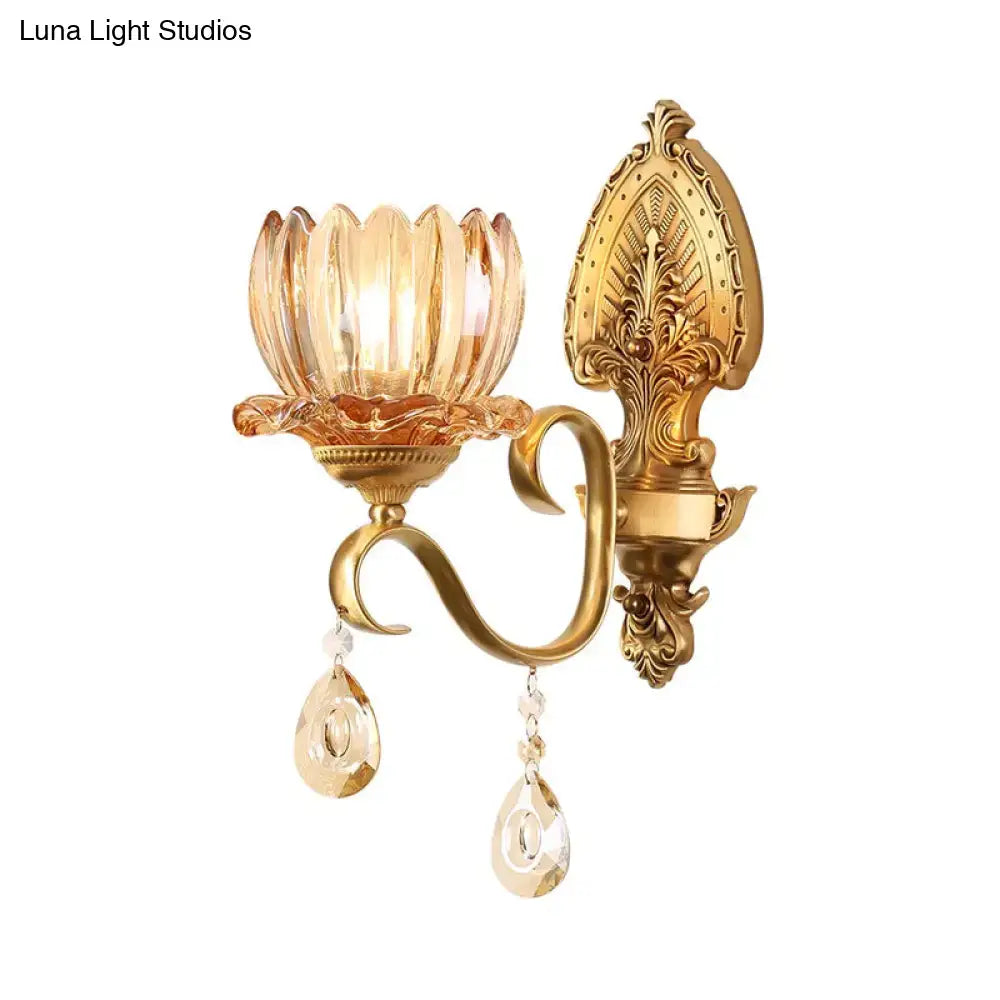 Ornate brass lotus wall sconce with a peach glass shade and dangling crystals compatible with e14 bulb