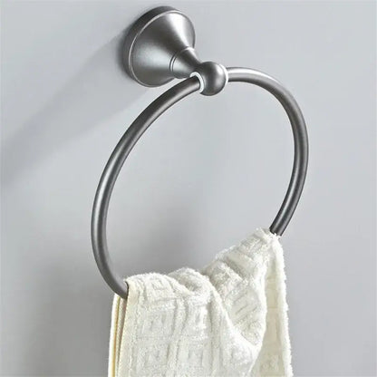 Ornate brushed nickel towel ring in gray bathroom accessories set holding a white textured towel for decorbites gray bathroom