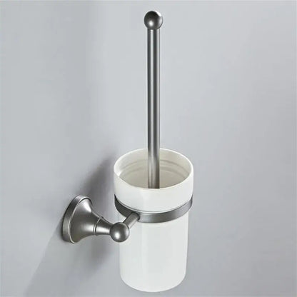 White ceramic toilet brush holder with brushed nickel wall mount and handle in ornate brushed nickel gray bathroom accessories set