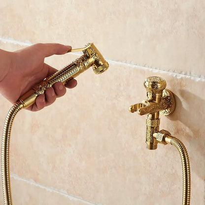 Ornate engraved gold brass wall mounted bidet faucet and sprayer with intricate floral decorbites brass wall design