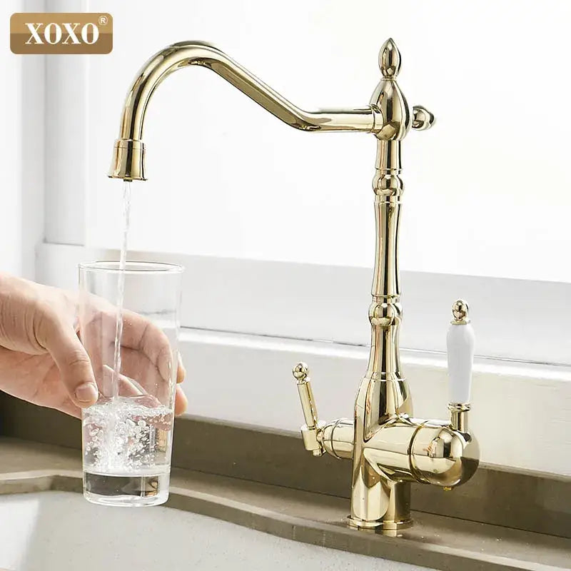 Ornate gold finished decorbites kitchen faucet mixer tap with white ceramic handles and detailed design for kitchen use