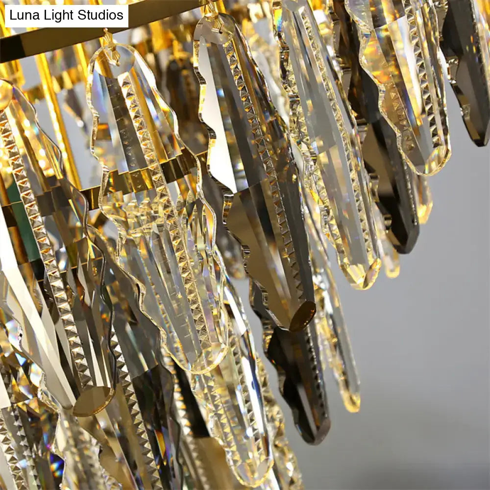 DecorBites™ minimalist crystal leaf pendant light features a gold-toned fixture with clear crystal prisms for bedrooms