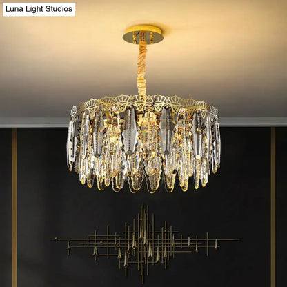 Gold-toned DecorBites™ minimalist crystal leaf pendant light with clear crystal prisms and ornate metalwork fixture width