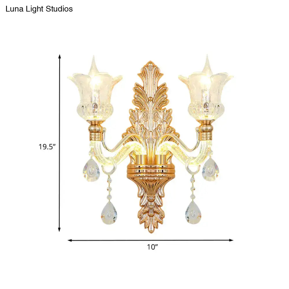 Ornate gold floral wall lamp with clear crystal glass shades and dangling crystal teardrop pendants bedroom sconce