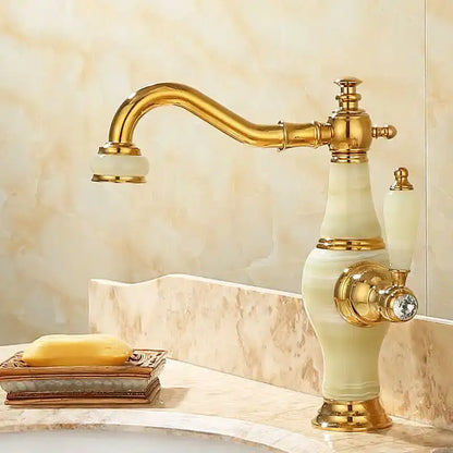 Elegant gold bathroom basin sink faucet with curved spout, cream onyx body, and ornate brass details for jade basin