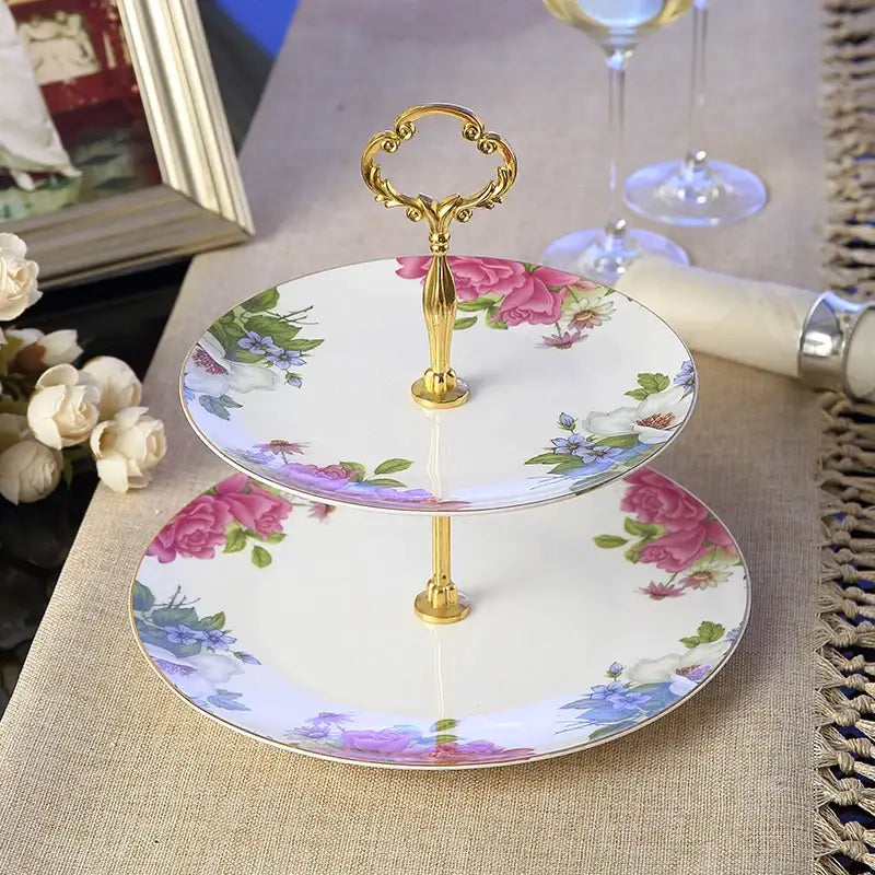 Two-tiered porcelain fruit plates set with gold-toned handle and pink purple blue floral pattern for dining room use