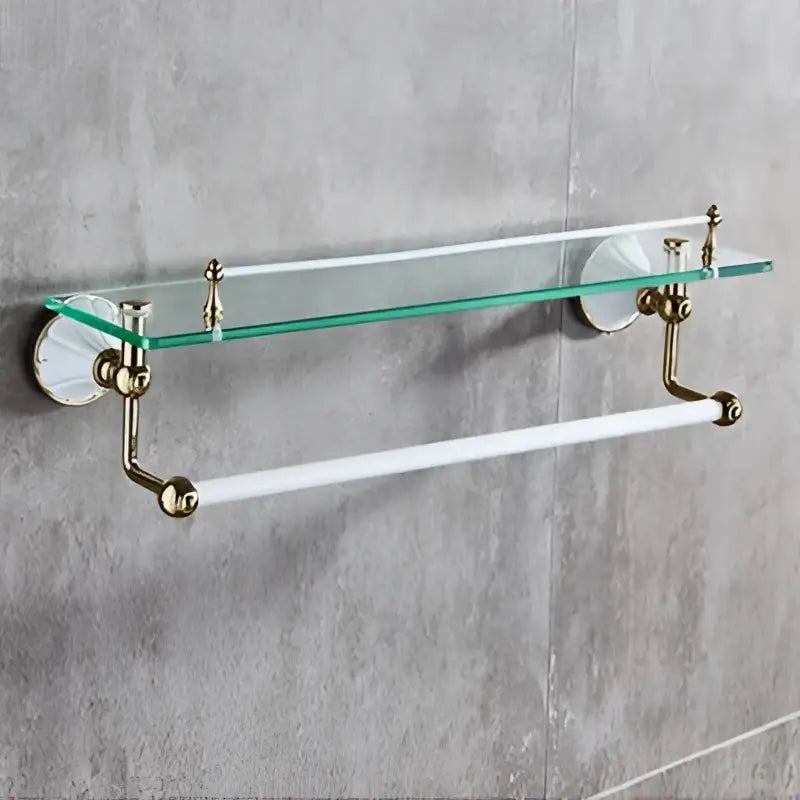 Antique brass-finished bathroom shelf with clear glass top and white towel bar from decorbites bathroom accessories set