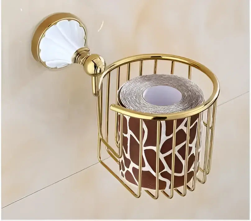 Ornate gold-toned metal toilet paper holder with white shell-shaped ceramic knob in decorbites bathroom accessories set