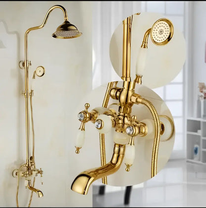 Ornate golden brass bath shower set with tall overhead rainhead handheld showerhead and white marble handles with crystals