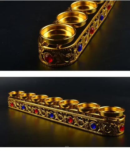 Ornate golden gem inlaid candlestick stand with six compartments and red blue gemstones for wedding altar decor