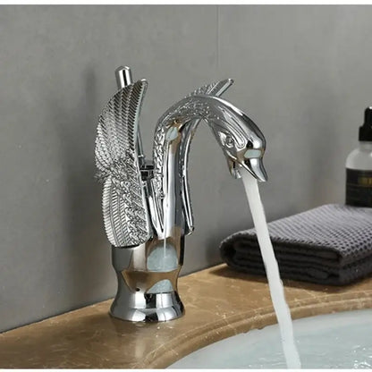 Ornate golden solid brass basin faucet with chrome finish ceramic valve core and swan-shaped detailed feathered wings