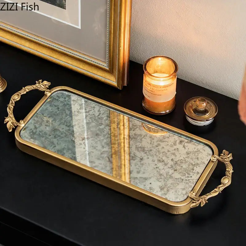 Ornate leaf handle decorbites golden mirror glass tray with gold frame and vintage-style mirrored surface for jewelry organization