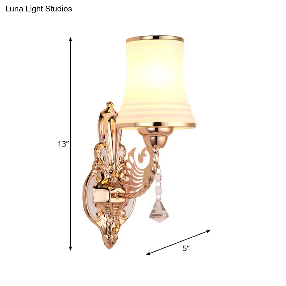 Ornate rose gold tapered bell wall sconce with opal glass tapered shade and crystal accents for bedroom lighting