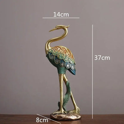 Ornate teal and gold crane bird sculpture with floral patterned wings on bronze base for living room decorbites crane bird decor