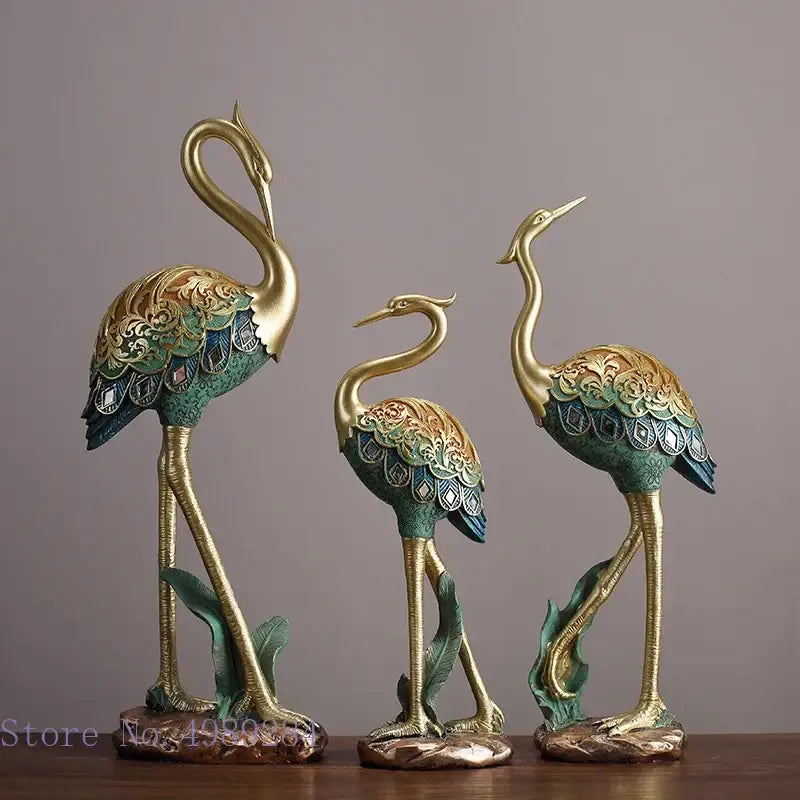 Ornate teal and gold crane bird sculpture with intricate feather patterns for living room decor by decorbites