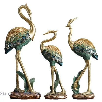 Ornate teal and gold crane bird sculpture with intricate engraved patterns for elegant living room decor by decorbites crane bird