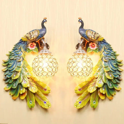 Ornate white gold peacock crystal wall lamp pair with iridescent feathers and spherical crystal-encrusted lights for decorbites gold peacock decor