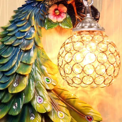 Ornate white gold peacock crystal wall lamp with iridescent feathers and glowing spherical shade for bedroom decorbites gold peacock