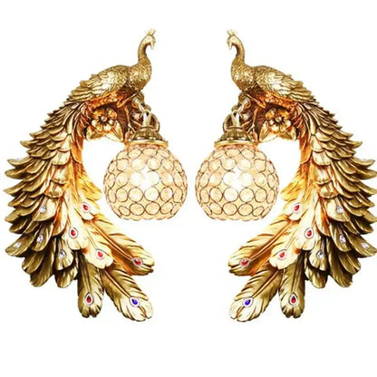 Ornate white gold peacock crystal wall lamp pair with intricate feather details and red and blue gemstones decorbites gold peacock