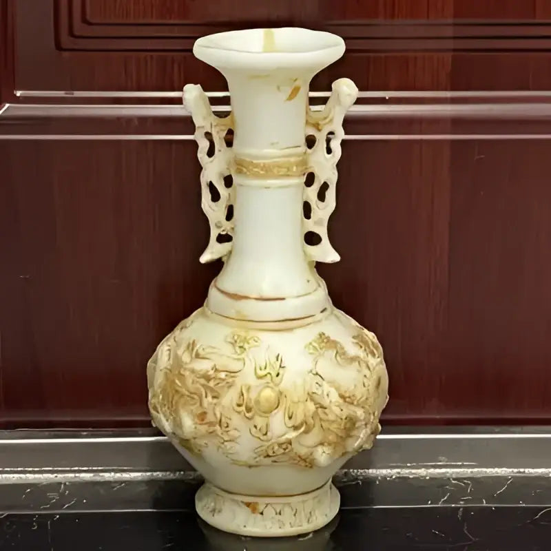 Ornate cream-colored porcelain vase with gold embossed jade dragons and decorative handles for white marble decorbites decor