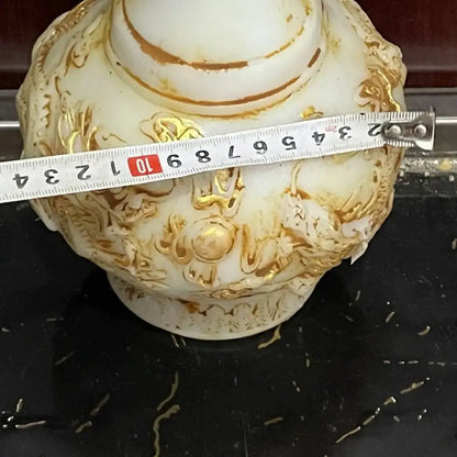 Ornate white porcelain vase with gold leaf detailing and embossed floral patterns for white marble jade dragons decorbites decor
