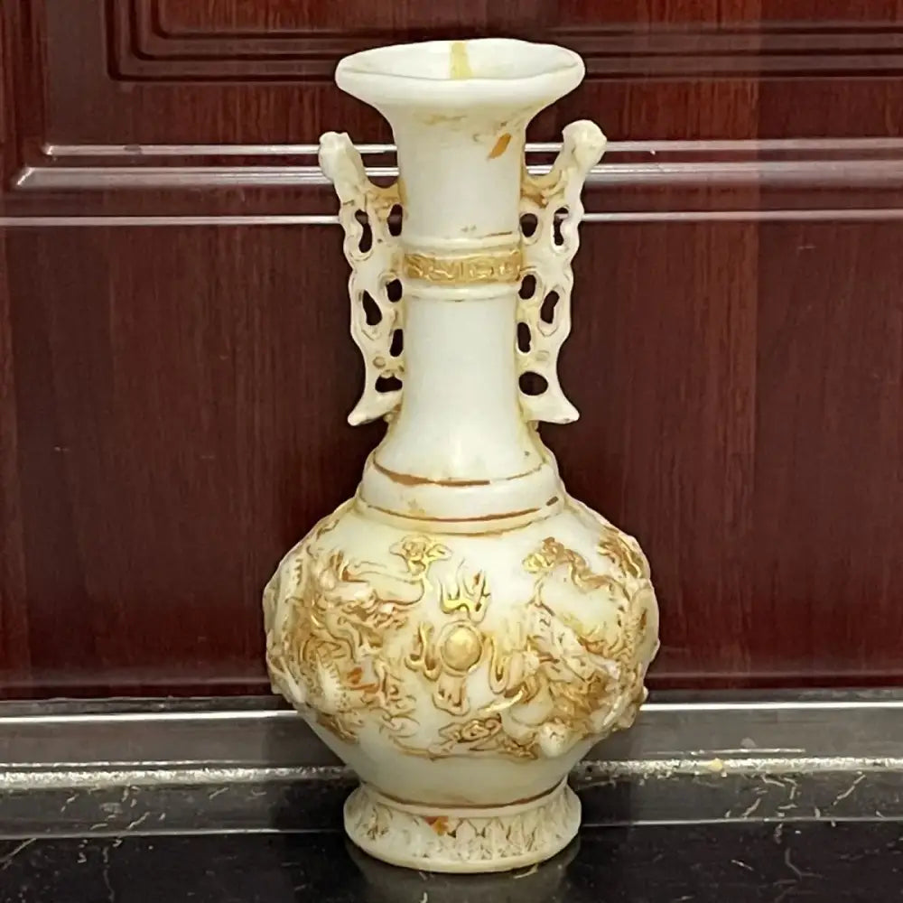 Ornate off-white porcelain vase with gold embossed jade dragons and pierced handles for decorbites white marble decor