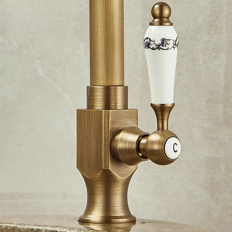Antique brass single hole outdoor antifreeze faucet with white ceramic handle and 360° swivel spout for cold use