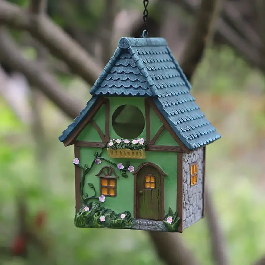DecorBites™ outdoor hanging resin birdhouse in green with blue roof wooden accents and pink flowers for small birds