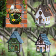 DecorBites™ outdoor hanging resin birdhouse with thatched roof in pastel pink and blue trim for small birds