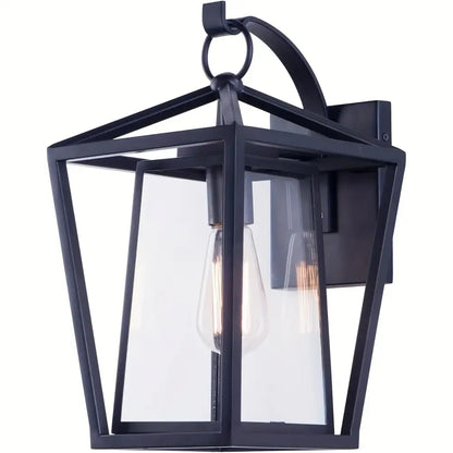 Black wrought iron outdoor wall light with glass shades featuring clear panels and an exposed filament bulb