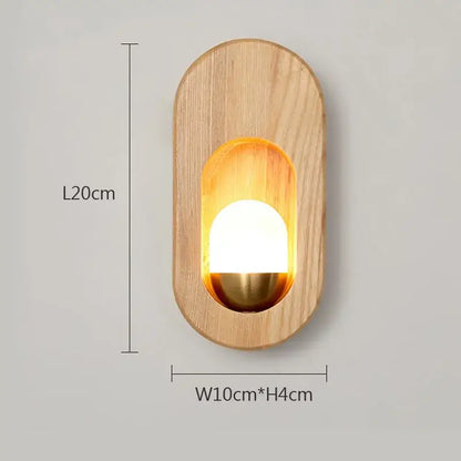 Minimalist oval led wooden wall lamp with warm amber glow and polished brass accent for bedroom decorbites led wooden wall