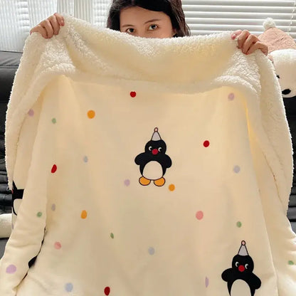 Cream-colored decorbites cozy fleece blanket with black penguin party hats and multicolored polka dots bedroom throw