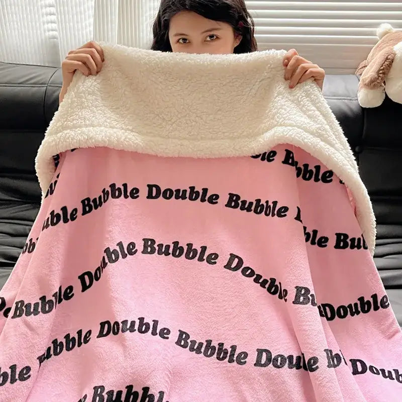 Pink plush panda pattern cozy fleece blanket with white sherpa border and black double bubble text by decorbites cozy fleece