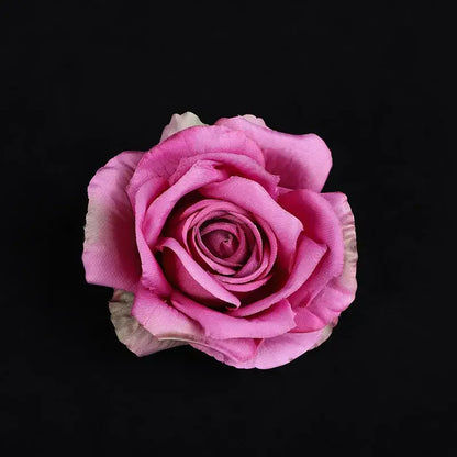 A delicate pink silk rose with soft layered petals and cream edges from a pastel 30pcs silk roses decor set