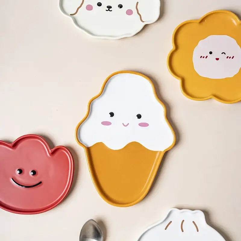 A cheerful yellow and white ice cream ceramic plate with a smiling face from decorbites cloud tulip cartoon dog tableware