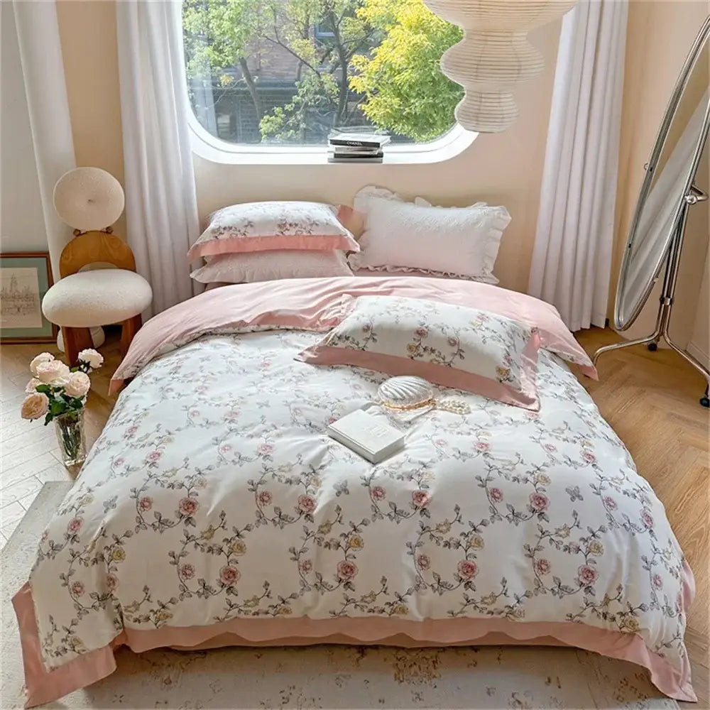 A pastel pink and white delicate floral-patterned bedding set with embroidered details from decorbites colorful bedding