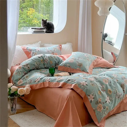 Pastel blue and peach floral bedding set with soft mint green embroidered blossoms and satin trim for colorful bedding decorbites