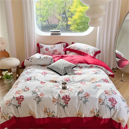 Pastel blue and peach floral bedding set featuring a ruffled duvet cover with pink and peach blossoms on white base
