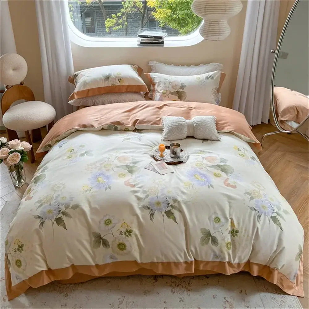 A cream-colored duvet cover with pastel floral patterns and peach satin trim in a decorbites colorful bedding set