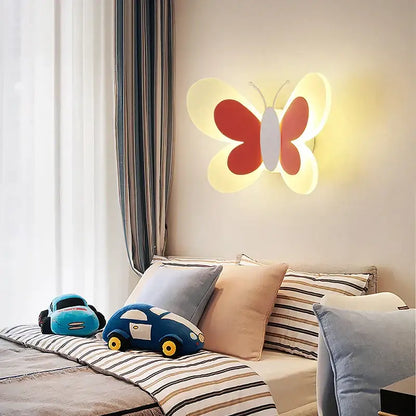 A warm glowing pastel butterfly wall lamp with red and white wings for kids bedroom and nursery decorbites butterfly wall