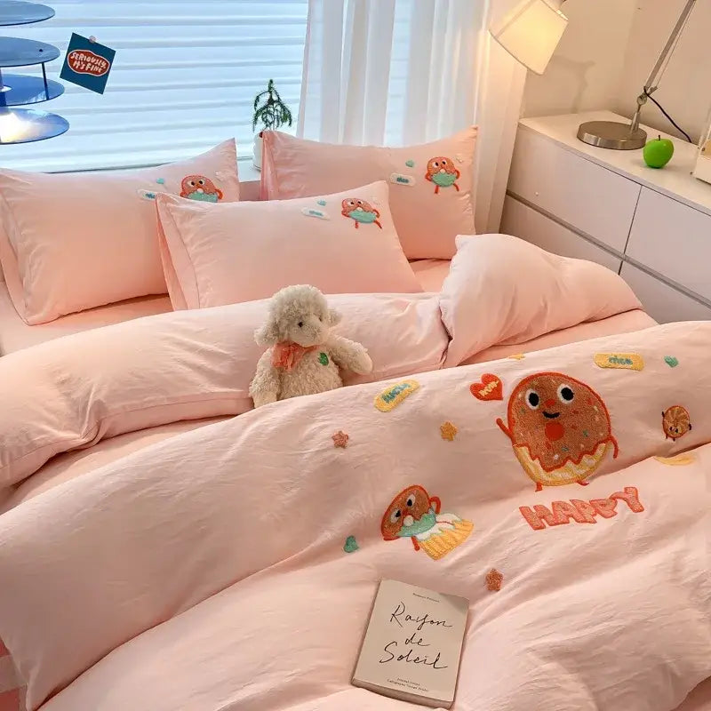 Pastel pink cartoon embroidered cotton bedding set featuring donut-themed decorbites design and soft fabric for bedroom