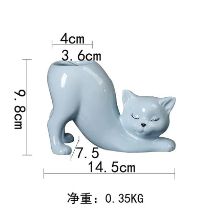 A smooth light blue pastel ceramic cat tail succulent planter with closed eyes and glossy finish for bedroom decorbites decor