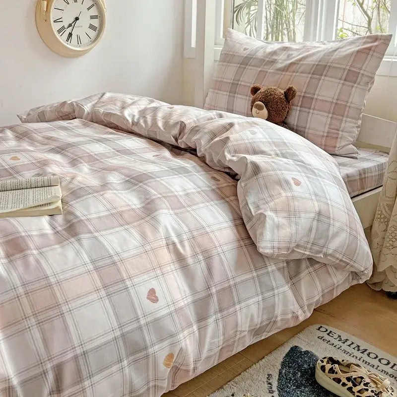 Pastel checkered cotton grid bedding set in soft pink and gray tones with subtle heart motifs on satin-like fabric