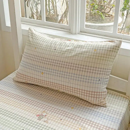 A cream-colored pastel checkered cotton grid pattern pillow with embroidered stars from decorbites bedding set