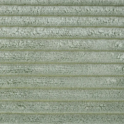 Soft sage green terry cloth towel with ribbed texture and faint stripes complementing decorbites corduroy pompom cushion cover