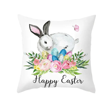 White throw pillow cover featuring easter egg bunny watercolor design with pastel eggs and happy easter script