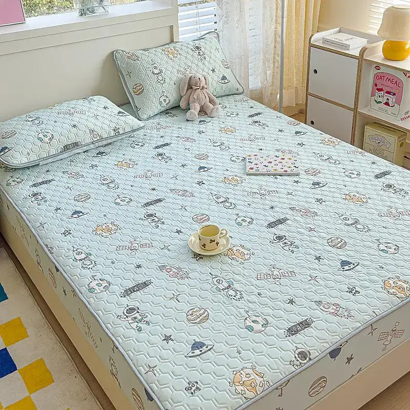 Light blue quilted fitted sheet set with playful astronaut and space pattern in soft pastel tones for bedroom use