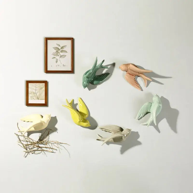 A collection of pastel flying bird ceramic wall ornaments in colorful ceramic for living room decor