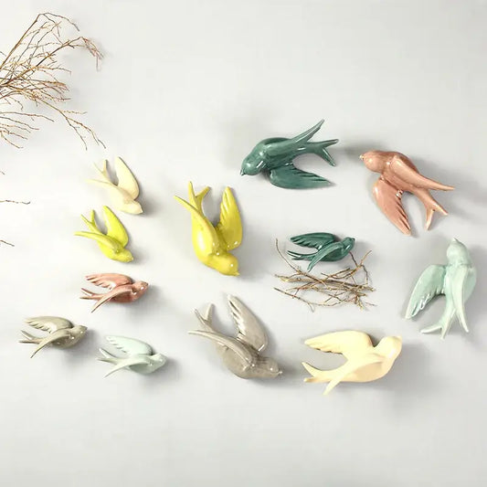 Pastel flying bird ceramic wall ornaments in green yellow pink and beige bird ceramic wall decor for living room