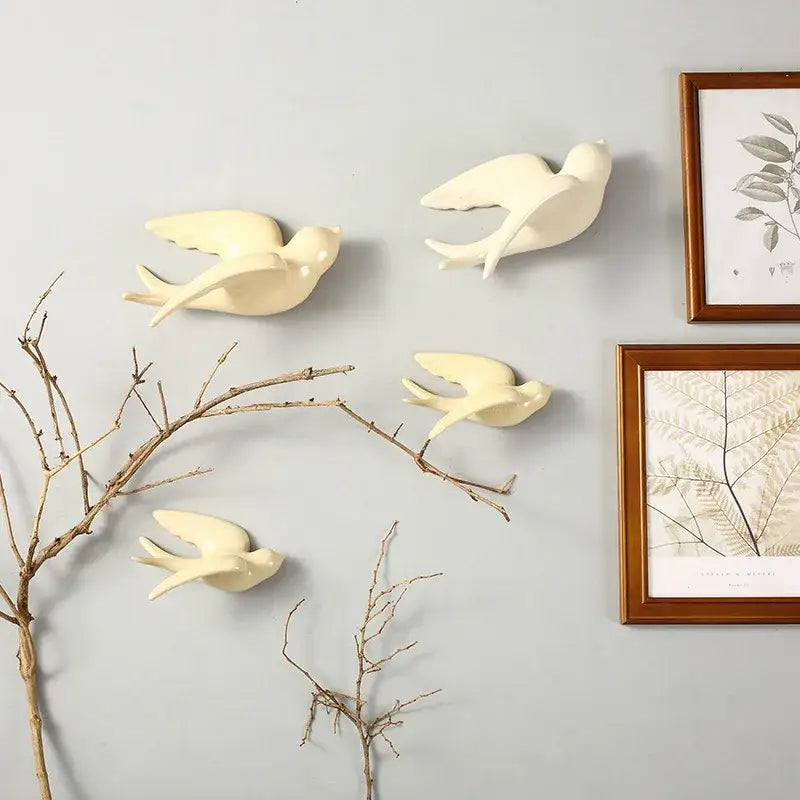 Cream-colored flying bird ceramic wall ornament featuring swallow designs in mid-flight for living room decor